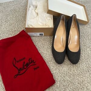Christian Louboutin Black Heels with Pointed Toe and Sleek Design